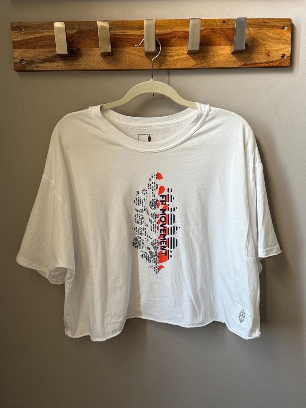 FP Movement by Free People - White Crop Tee with Orange & Black Vertical Graphic